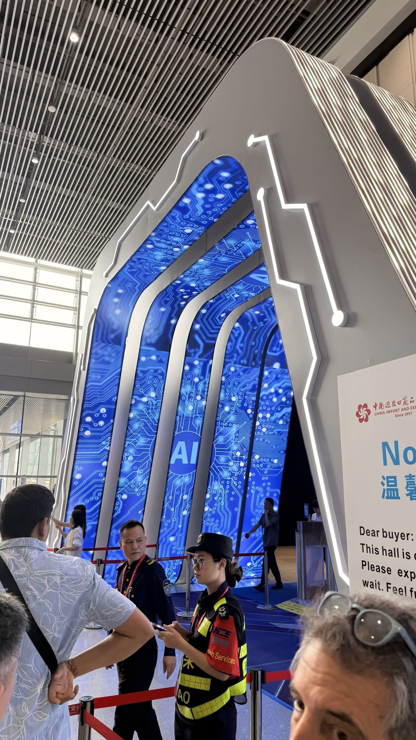 The glowing blue circuit-board archway at the entrance to the AI hall