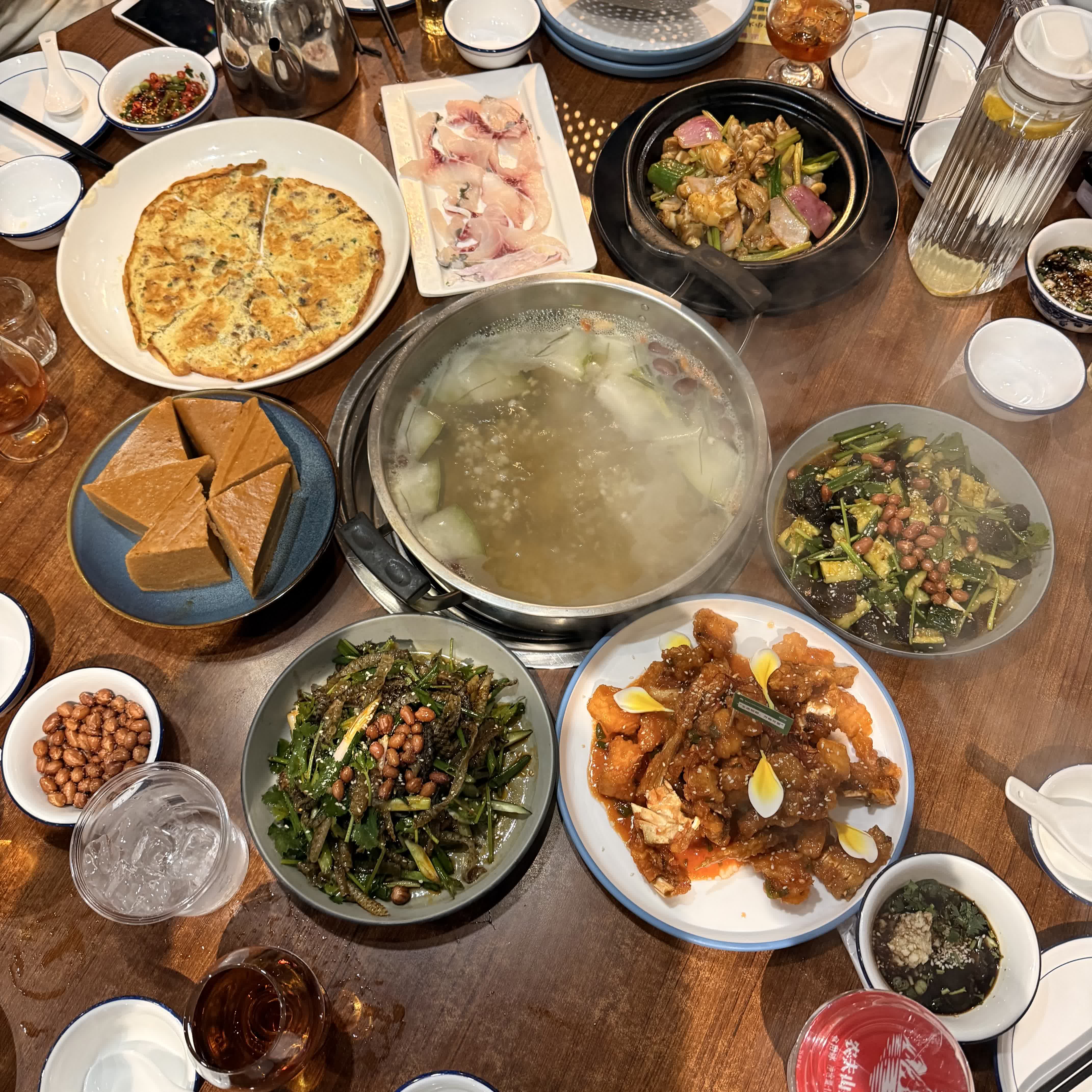 A full table of Chinese dishes, soup, and sides