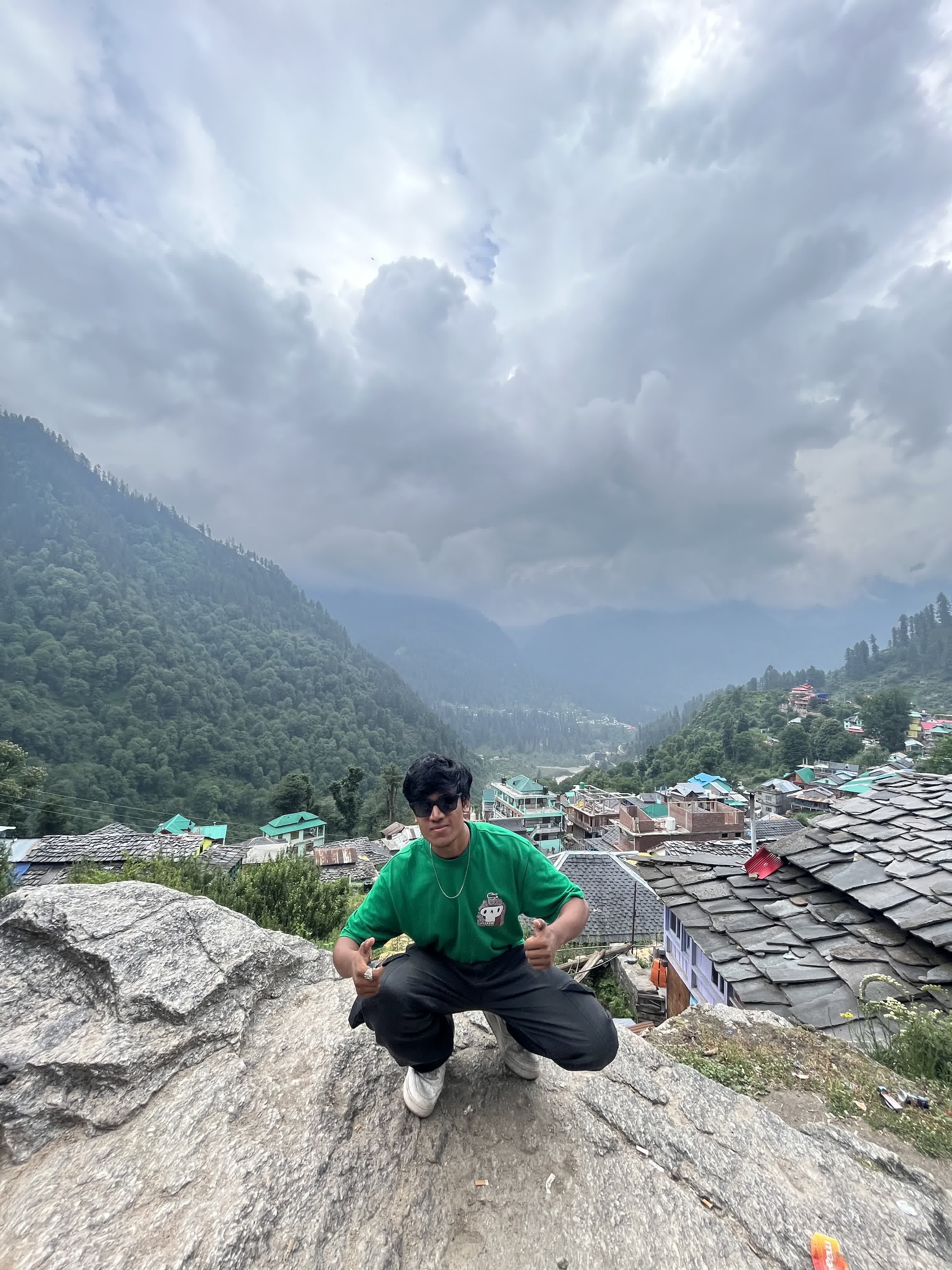 Crouched on a rock above a slate-roofed Himachali village in the valley